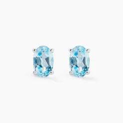 Histoire d'Or Boucles D'oreilles Puces Ovale Serti Griffe Or Blanc Topaze or blanc topaze bleue