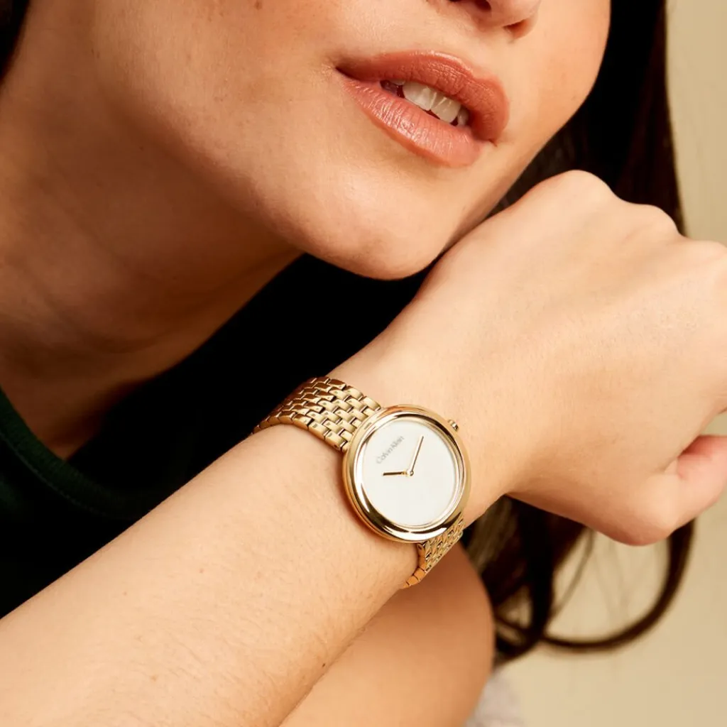 CALVIN KLEIN Montre Twisted Bezel Blanc cadran doré fond blanc bracelet acier doré Sale