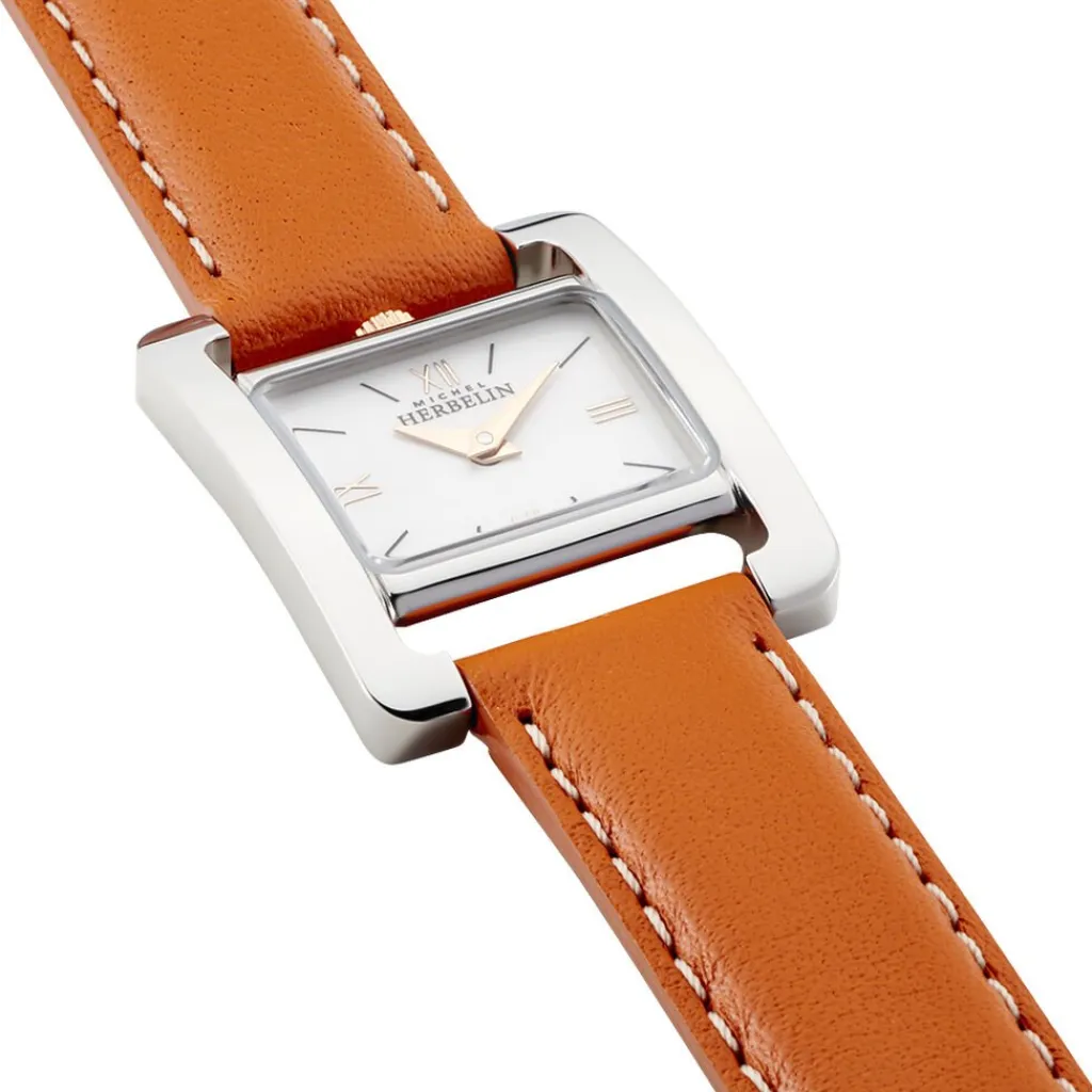 HERBELIN Montre 5Eme Avenue Blanc cadran argenté fond blanc bracelet cuir orange New